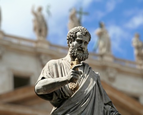 Marble statue of Saint Peter at the entrance of St. Peter's Basilica, overlooking St. Peter's Square, Vatican City.