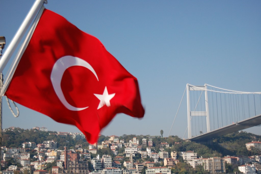The national flag of Turkey, featuring a white star and crescent on a red background.
