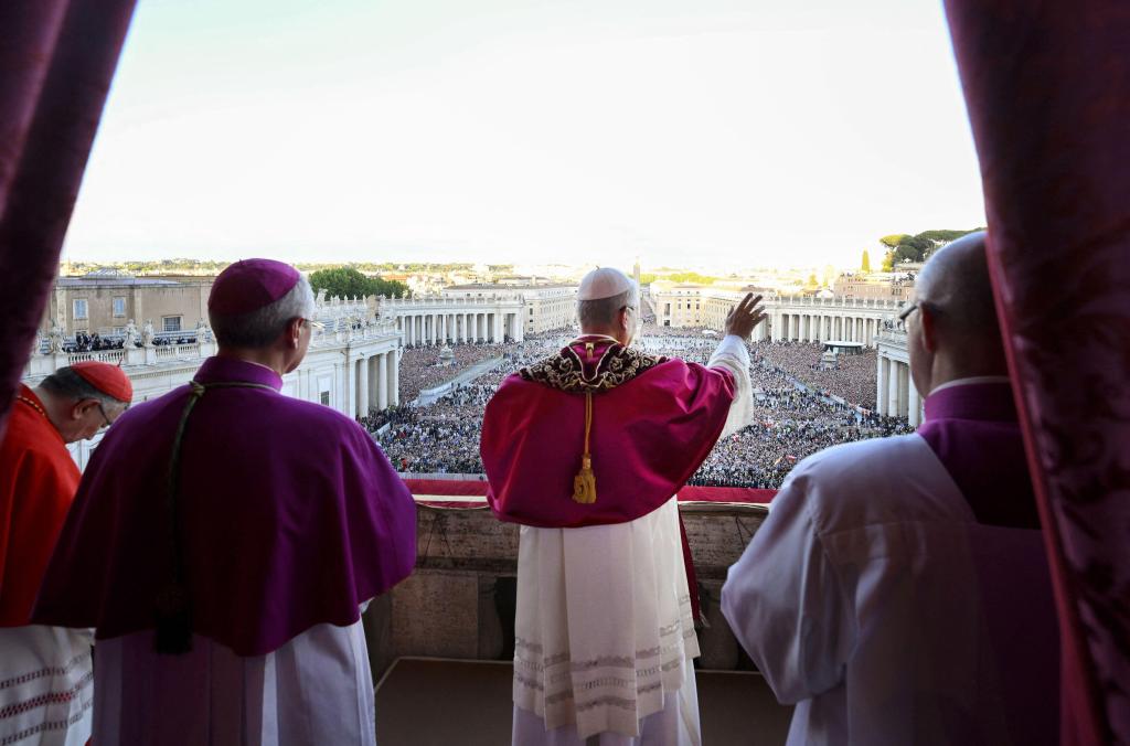 New pope Leo XIV appears at the central Loggia of St. Peter's Basilica to greet faithful crowding St. Peter's Square following his election at the Vatican, on May 8, 2025. The Conclave has elected North American cardinal Robert Francis Prevost who has tak