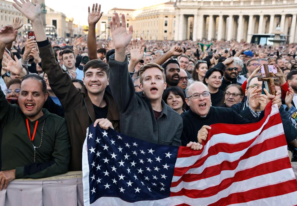 Pilgrims from Texas, USA celebrate in Saint Peter's square after white smoke appeared from the Sistine Chapel for the newly elected Pontiff, Pope Leo XIV on May 08, 2025 at the Vatican. The Conclave has elected North American cardinal Robert Francis Prevo